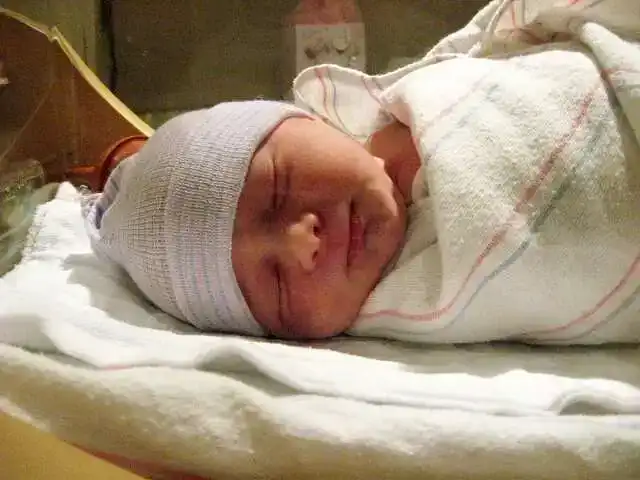 Swaddled newborn baby