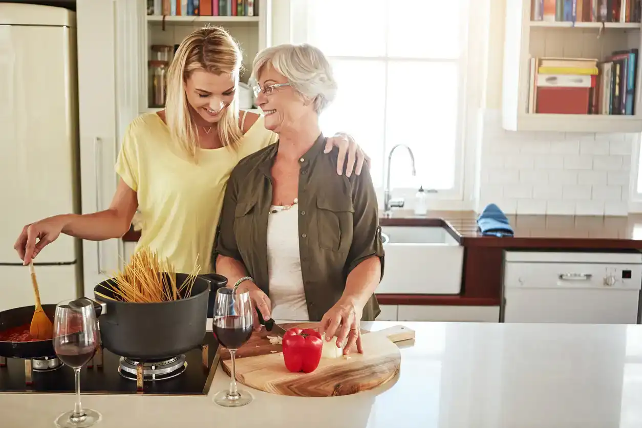 Shot of a senior woman and her daughter cooking in the kitchen
