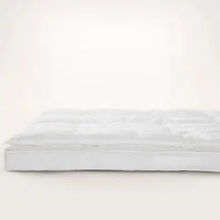 Coprimaterasso Cloud Cover su sfondo beige.