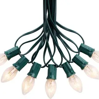 Luci di Natale d'annata di Brightown contro una priorità bassa bianca.