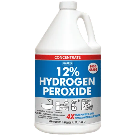 Duża biała butelka nadtlenku wodoru z niebiesko-czerwoną etykietą.' loading='lazy' title=