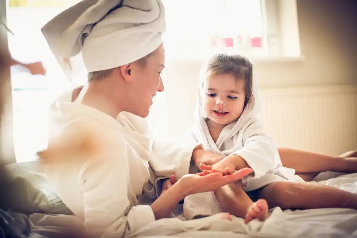 Mother and daughter at-home spa day with hair towels